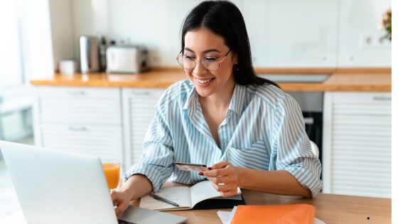 happy woman using laptop